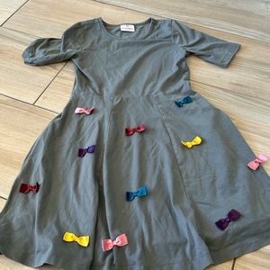Hanna Anderson grey dress with rainbow bows size 130 which is a size 10